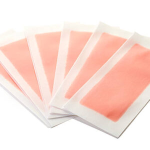 Pink waxing strips isolated on white background