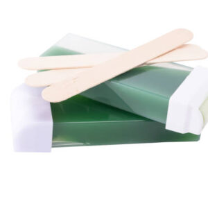 Concept of the wax and wooden sticks for the hair, isolated on white background