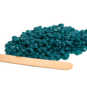 Spa wax for depilation in granular form on the white background