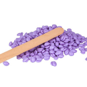 Aromatherapy violet lavender wax drops for depilation isolated on the white